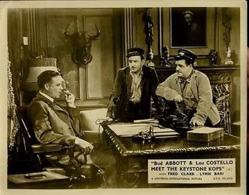 Frank Wilcox at his desk, Bud and Lou talking, in "Abbott and Costello Meet the Keystone Cops"