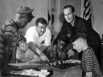 Behind the dignified entrance to the Costello Youth Foundation, hundreds of kids learn how to have all kinds of fun -- often, as in the checker game, under the expert tutelage of President Lou Costello and Secretary Bud Abbott.