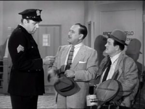 Mike the cop, Bud Abbott, and Lou Costello in Pest Exterminators - The Abbott and Costello Show season 2