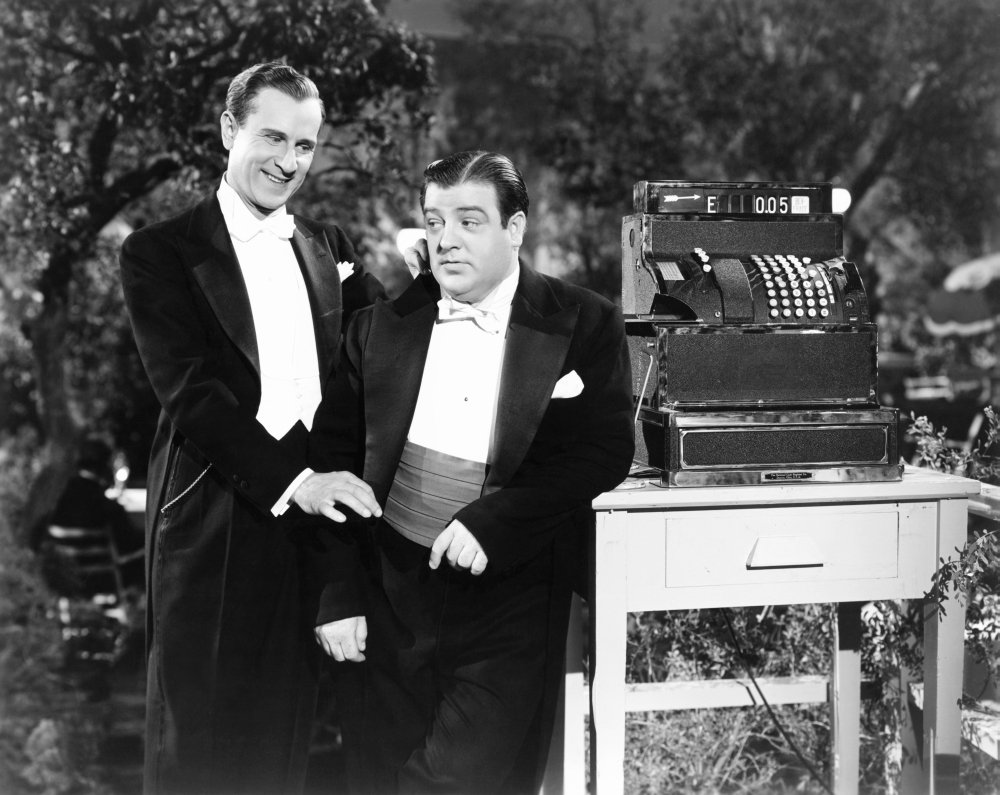 Bud Abbott and Lou Costello in tuxedos in the (tacked on) ending of "Hold That Ghost"