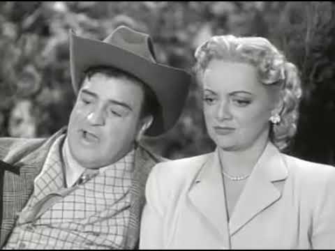 Lou Costello, impersonating a wealthy Texas oil man, courting Connie Cezan on a park bench in "Well Oiled"