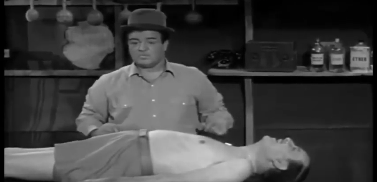Lou Costello about to give Bud Abbott a massage in Barber Lou