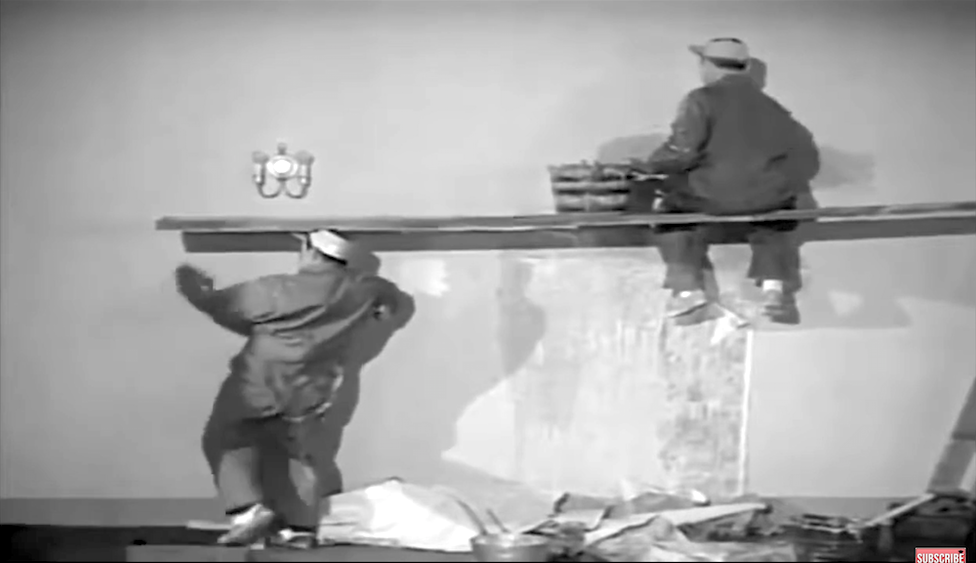 Lou Costello is about to pull the board out from under Bud Abbott