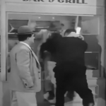 Bud Abbott gets thrown through the window of Brody's Seafood Bar & Grill - his payment for his scheme
