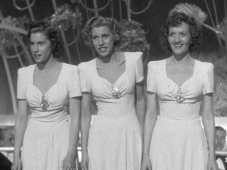 The Andrews Sisters singing at the nightclub in "Hold That Ghost"