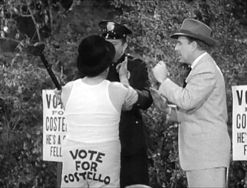 Vote for Costello!  Good thing Mike the Cop arrests Lou before he gives away anything else! The Politician - The Abbott and Costello Show, season 1