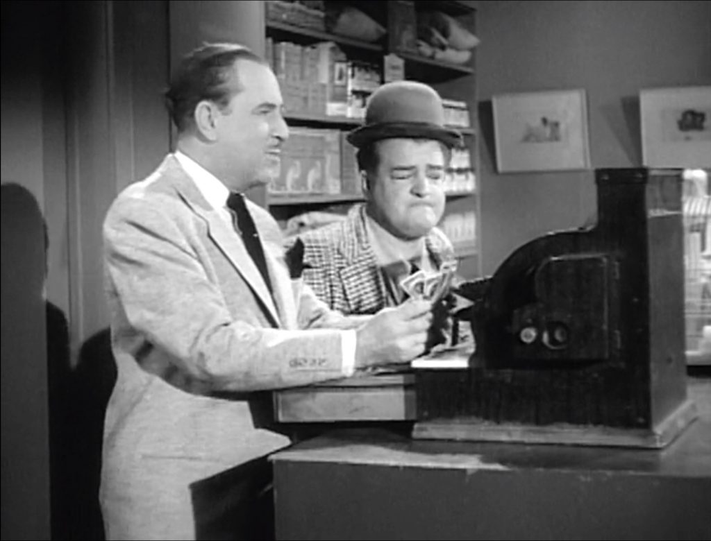 Bud Abbott and Lou Costello working at the pet store in "Bingo the Chimp"