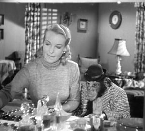 Hillary Brooke and Bingo the chimp putting on makeup in "Television"