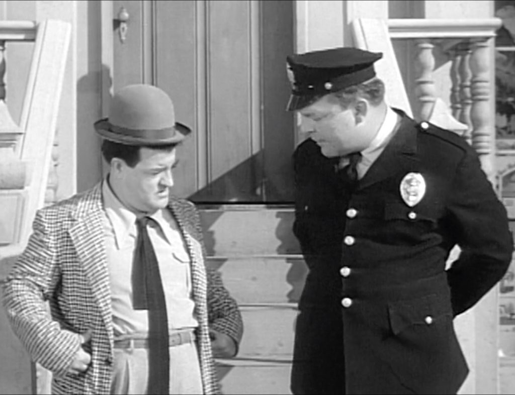 Lou Costello and the helpless Mike the Cop in "In Society"