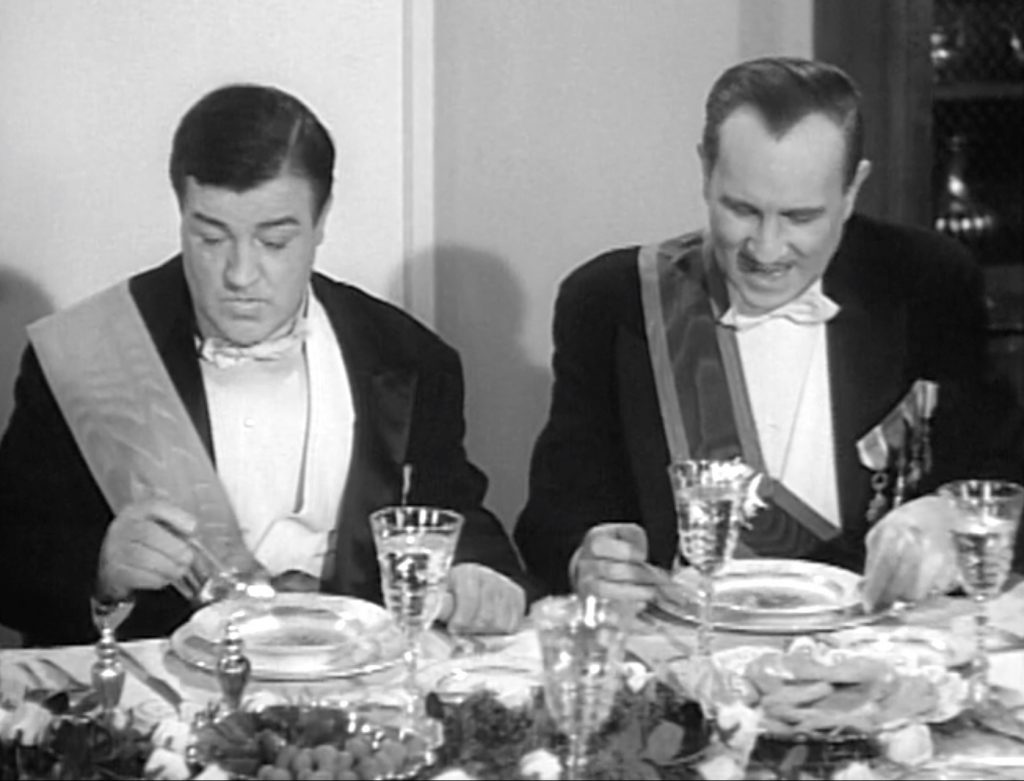Lou Costello and Bud Abbott at the high society dinner party "In Society"