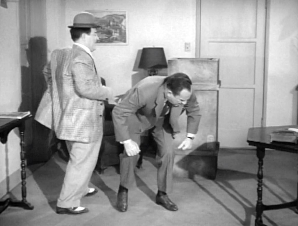 Lou Costello's bad back is caught by Bud Abbott in Cheapskates