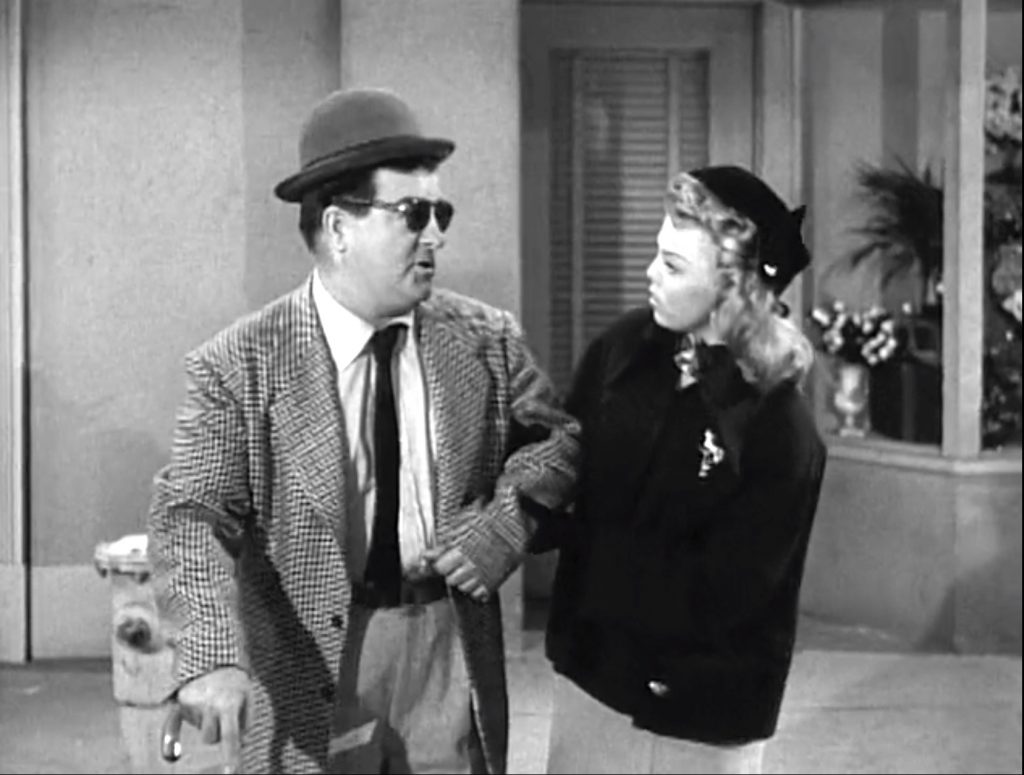 Lou Costello pretends to be blind in order to talk to the pretty young woman in "South of Dixie"