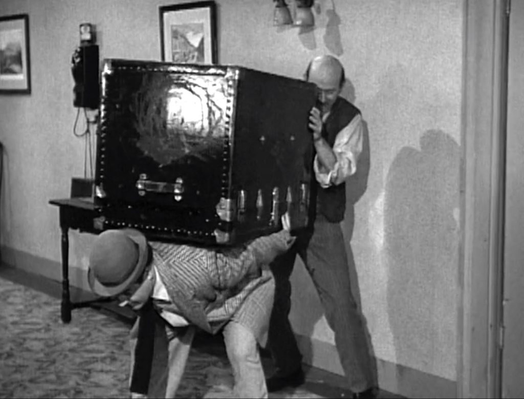 Lou Costello helping Sid Fields move the trunk for the new boarder in "South of Dixie"