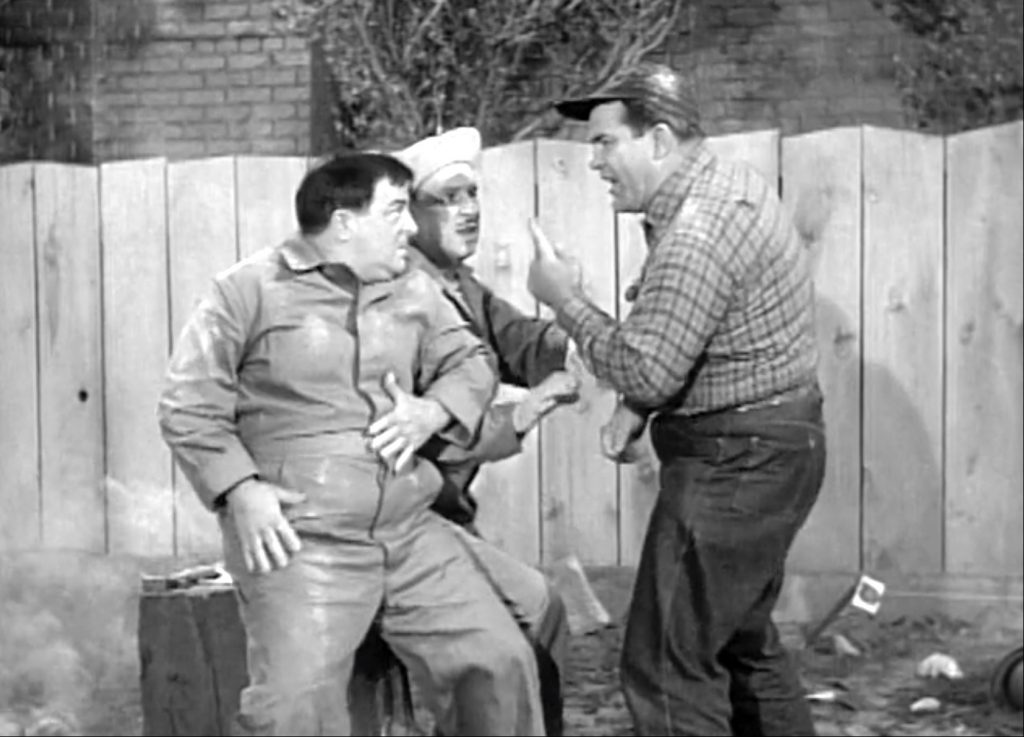 Neighbor Dick Wessel threatens Bud Abbott and Lou Costello as the dynamite's about to blow!