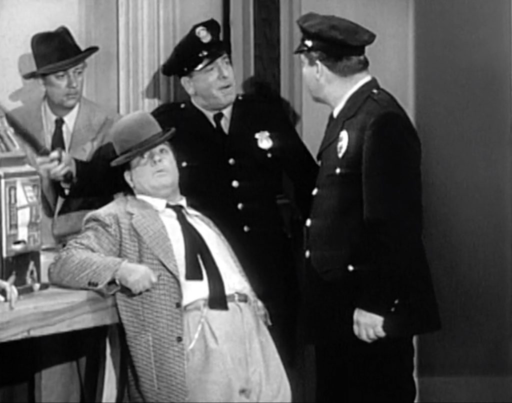 Lou Costello knocked silly at the gambling raid in "Amnesia"