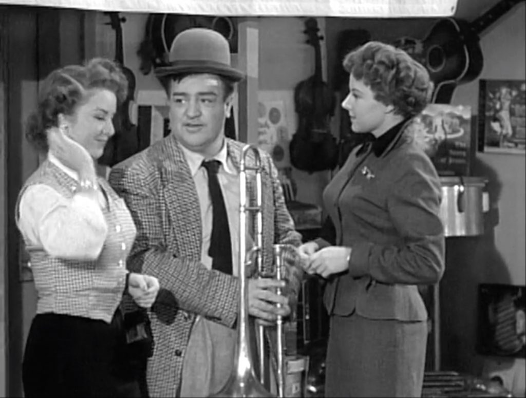 Lou Costelelo tries to break up a fight between two pretty young ladies over a trombone - by giving each half!