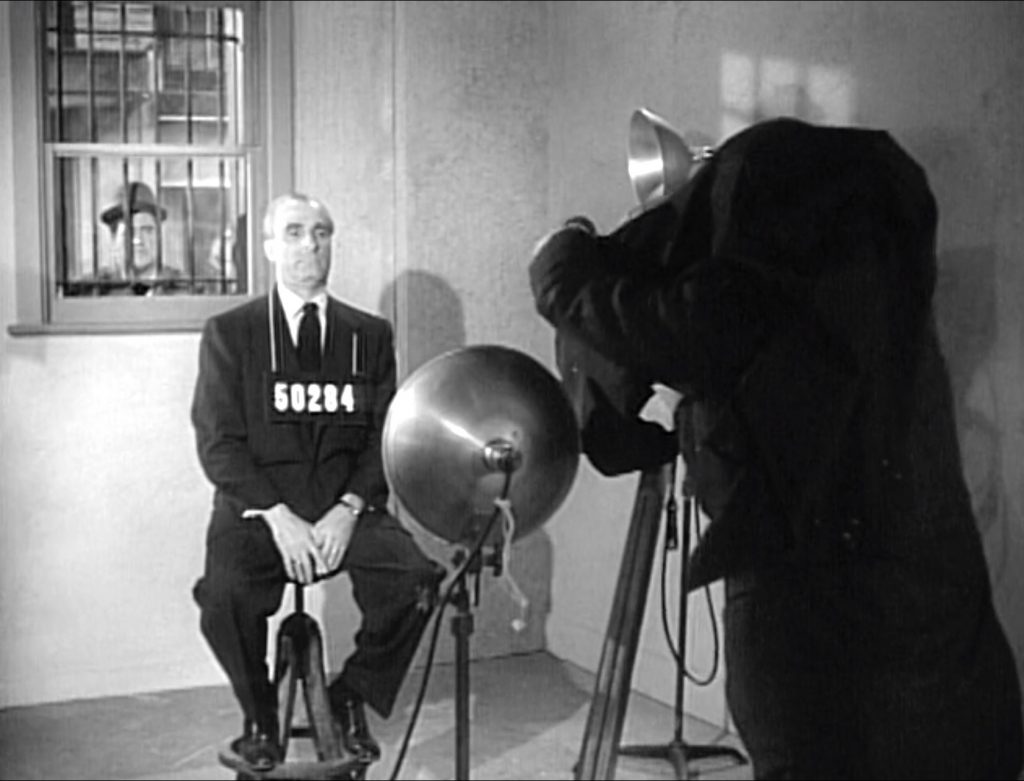 Criminal Dapper Dan getting his mugshot photo taken in "Public Enemies"