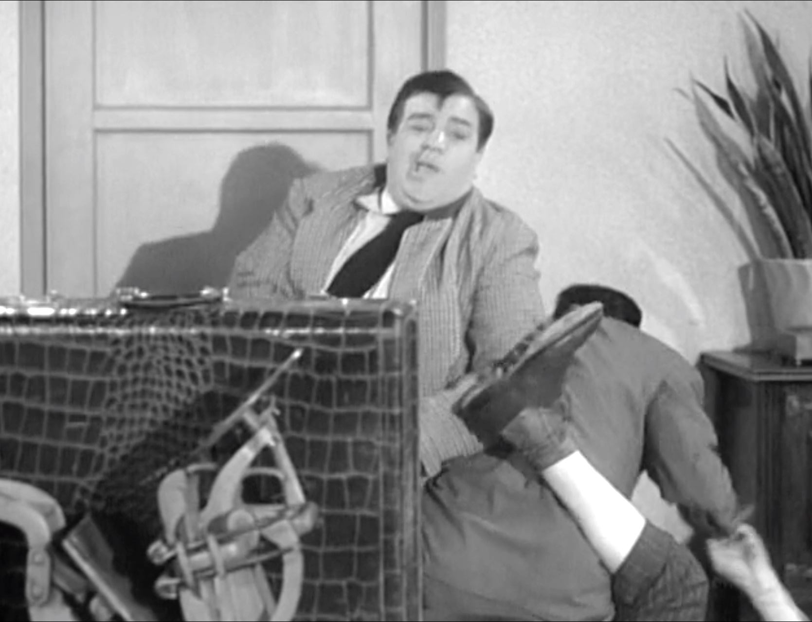 Lou Costello "helping" Bud Abbott fight the crooks