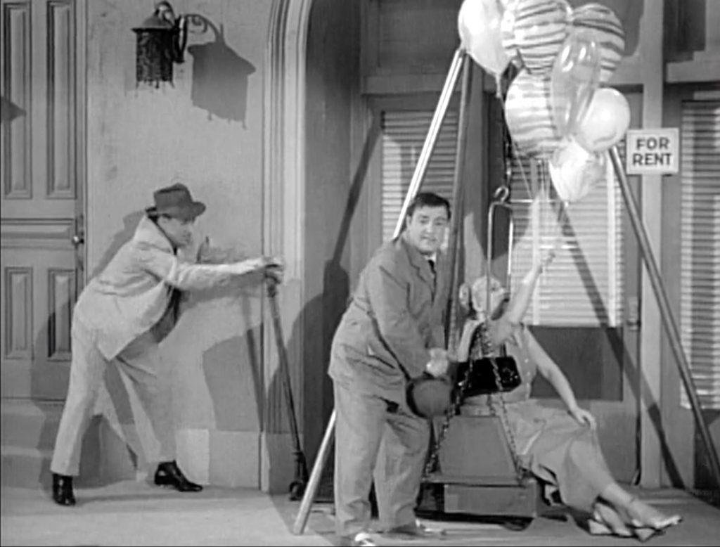 Bud Abbott and Lou Costello lifting the fat lady out of the broken weight machine