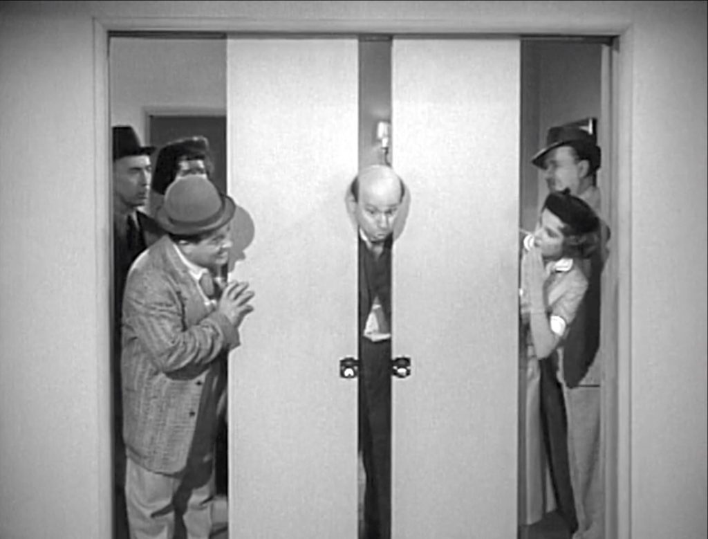 Sid Fields "demonstrating" the sliding doors in the Honeymoon House