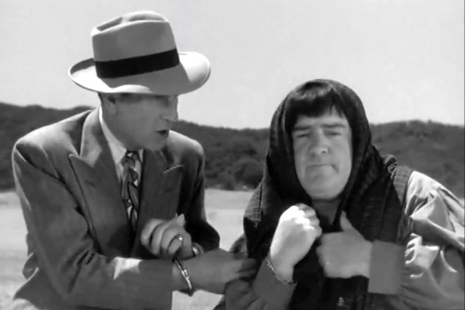 Harry (Bud Abbott) recognizes the disguised Joe (Lou Costello)
