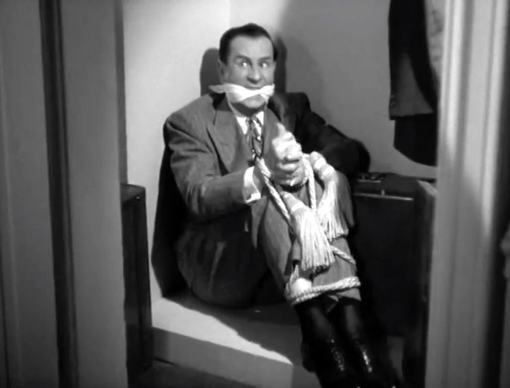 Harry (Bud Abbott) is all tied up in "Mexican Hayride"