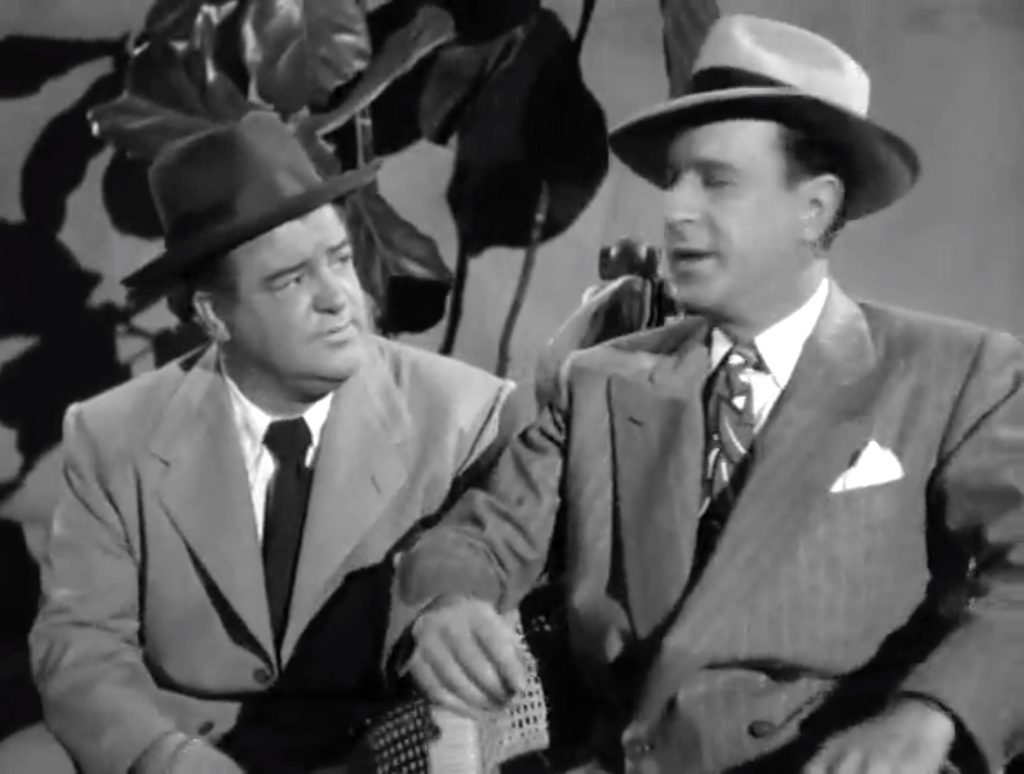Joe (Lou Costello) doesn't trust con man Harry (Bud Abbott) in "Mexican Hayride" - with good reason!