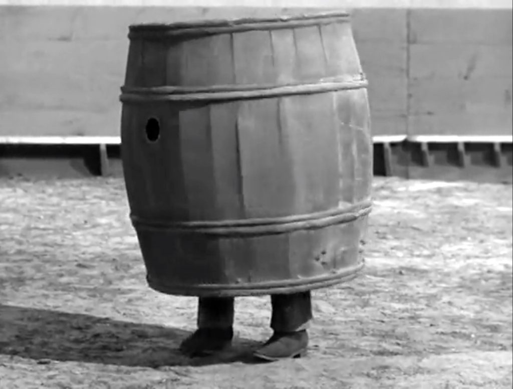 Lou Costello tries hiding from the angry bull in a barrel in "Mexican Hayride" - but the bull won't stop!