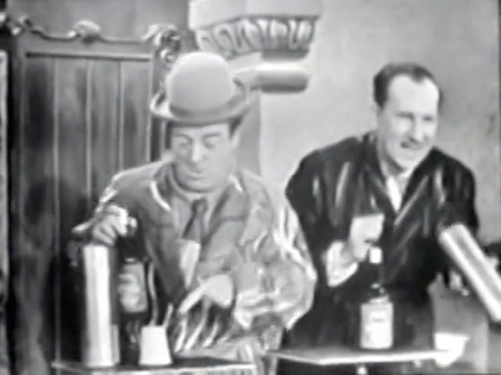 Lou Costello tries to interfere with Bud Abbott's Passe-Passe Bottle magic trick