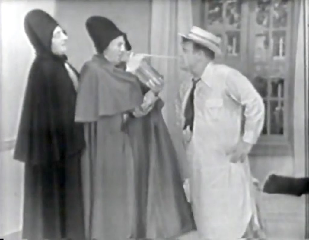 Two of the inmates, after pretending to shoot each other, squirt Lou Costello with a seltzer bottle!