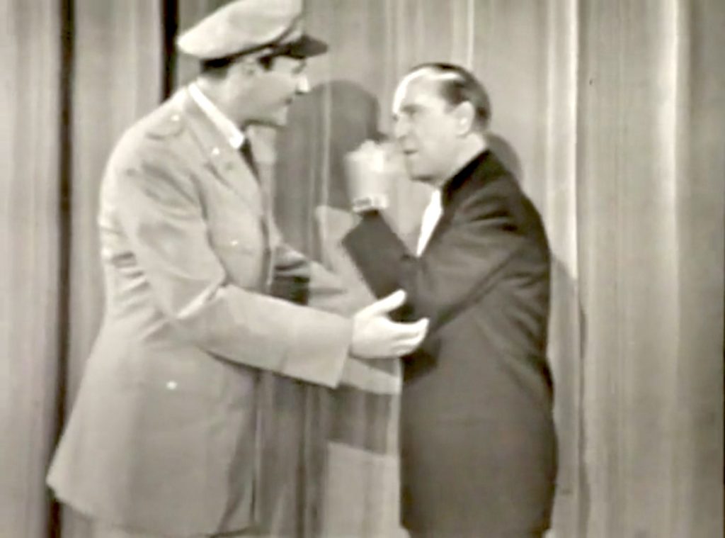 Colonel Milton Frome and Bud Abbott try to set up a USO Show