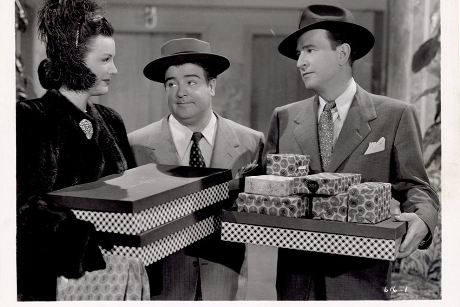 Bud and Lou carrying presents